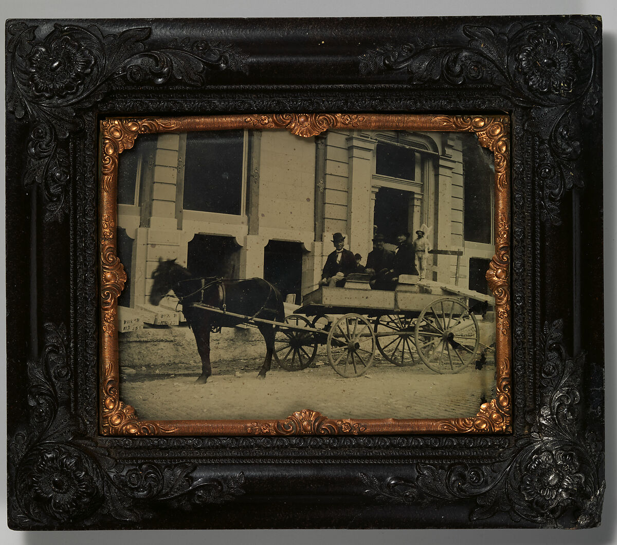 [Three Men Seated in a Horse-Drawn Buggy in Front of a Building Under Construction], Unknown (American), Ambrotype 