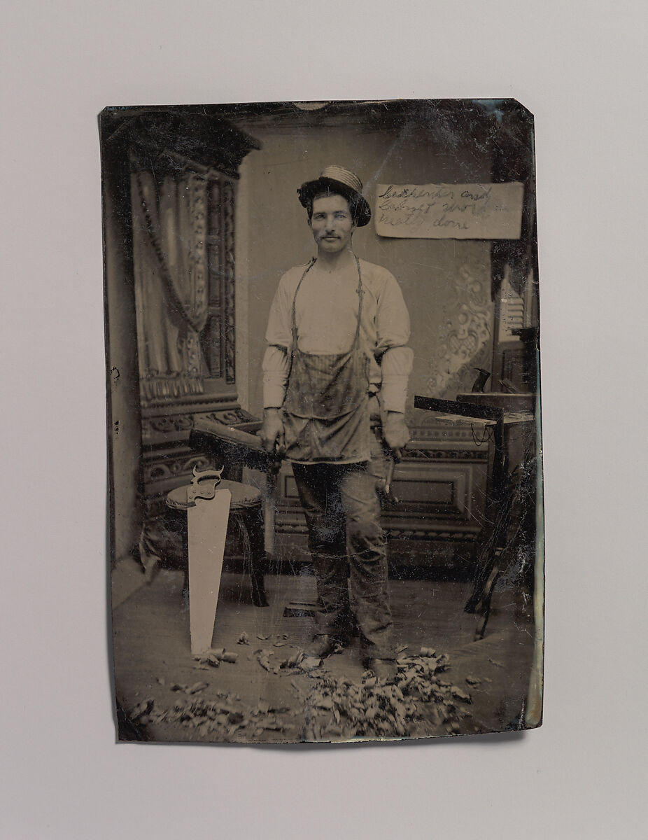[Carpenter or Cabinetmaker Standing Before a Sign Advertising His Trade], Unknown (American), Tintype with applied color 