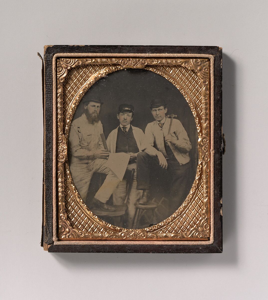 [Three Carpenters, Standing, Holding a Ruler, Hammer, and Sheet of Paper], Unknown (American), Ambrotype with applied color 