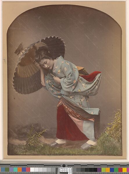[Woman with Umbrella in Rain], Raimund von Stillfried (Austrian, 1839–1911), Albumen silver print from glass negative with applied color 