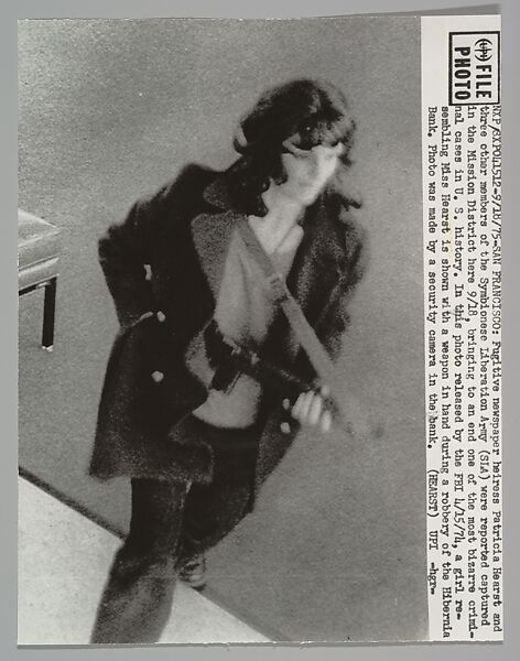 SAN FRANCISCO. Fugitive newspaper heiress Patricia Hearst and three other members of the Symbionese Liberation Army (SLA) were reported captured in the Mission District here 9/18, bringing to an end one of the most bizarre criminal cases in U.S. History. In this photo released by the FBI 4/15/74, a girl resembling Miss Hearst is shown with a weapon in hand during a robbery of the Hibernia Bank, United Press International (American), Gelatin silver print 