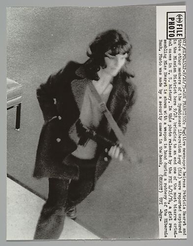 SAN FRANCISCO. Fugitive newspaper heiress Patricia Hearst and three other members of the Symbionese Liberation Army (SLA) were reported captured in the Mission District here 9/18, bringing to an end one of the most bizarre criminal cases in U.S. History. In this photo released by the FBI 4/15/74, a girl resembling Miss Hearst is shown with a weapon in hand during a robbery of the Hibernia Bank