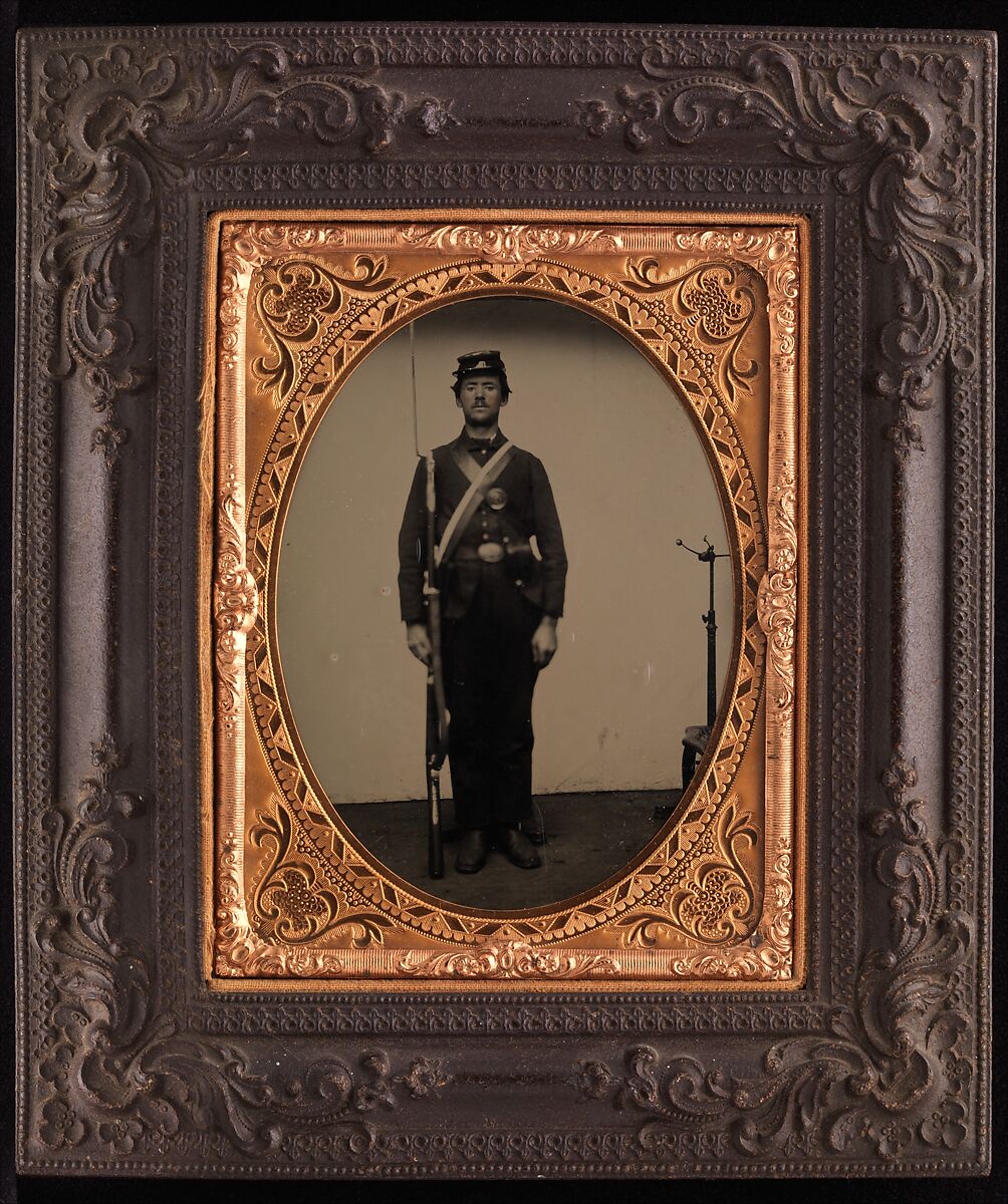 [Union Soldier Holding Rifle, with Photographer's Posing Stand], Unknown (American), Ambrotype with applied color 