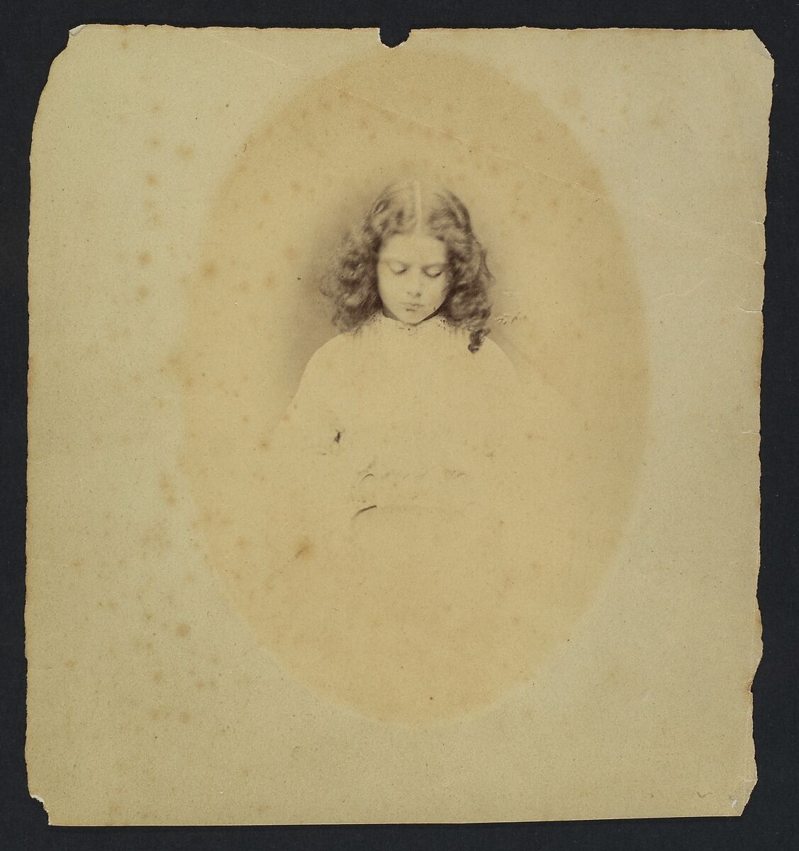 Edith Liddell Seated Beside a Vase of Foxgloves, Lewis Carroll (British, Daresbury, Cheshire 1832–1898 Guildford), Albumen silver print from glass negative 