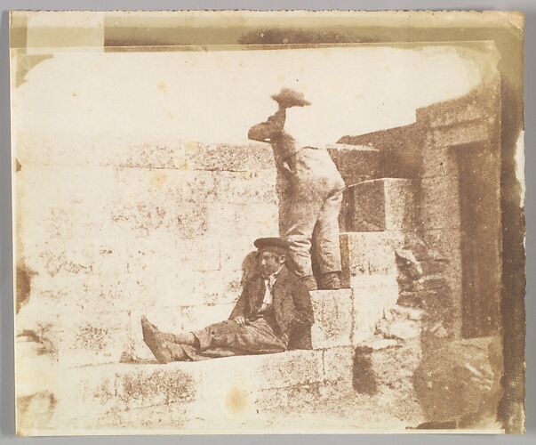 Two Young Men Resting on a Pier