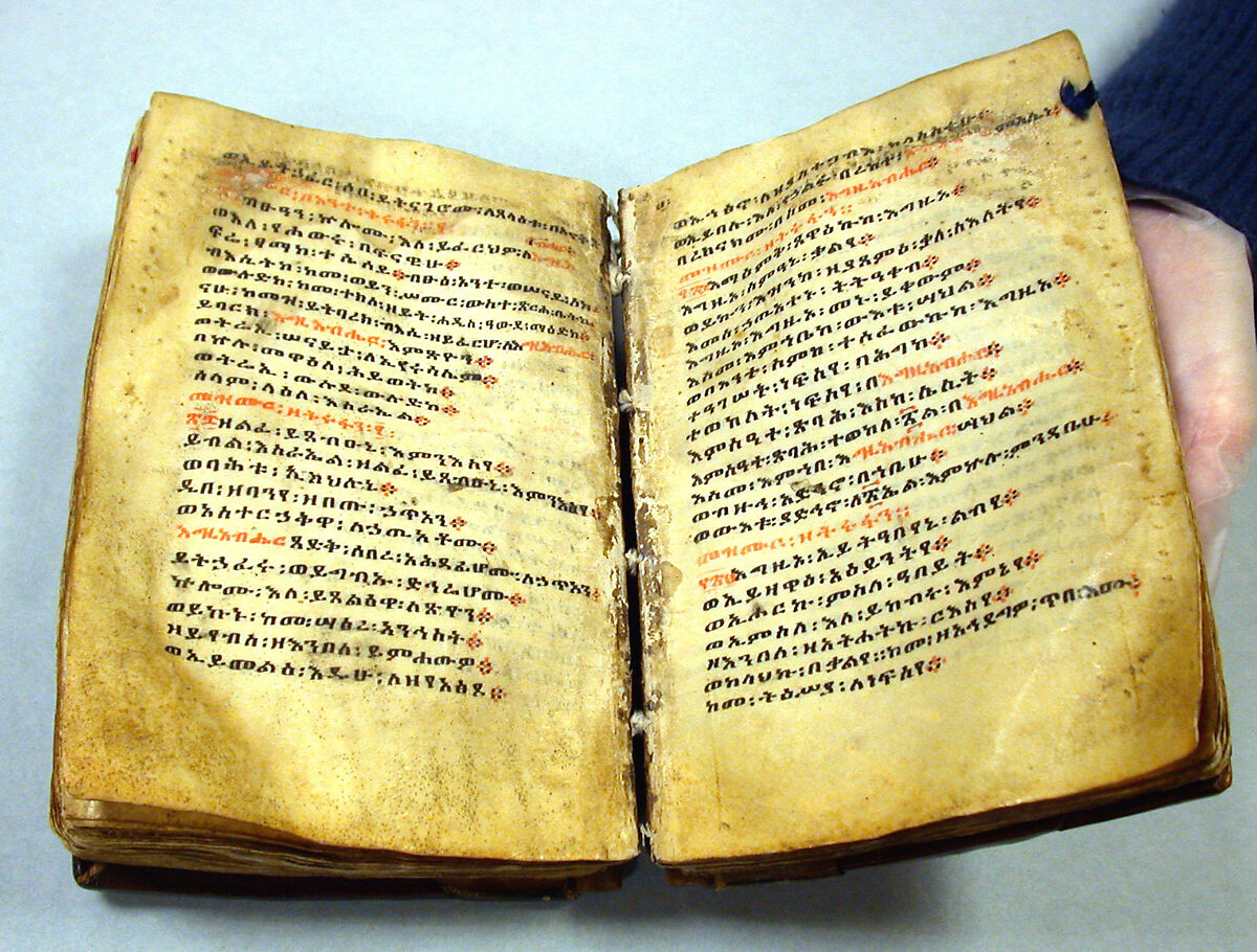 Prayer book with case (mahdar), Wäldä Maryam (African, Amhara or Tigrinya), Parchment (vellum), pigment (red, blue, ochre, and black), leather, wood, string