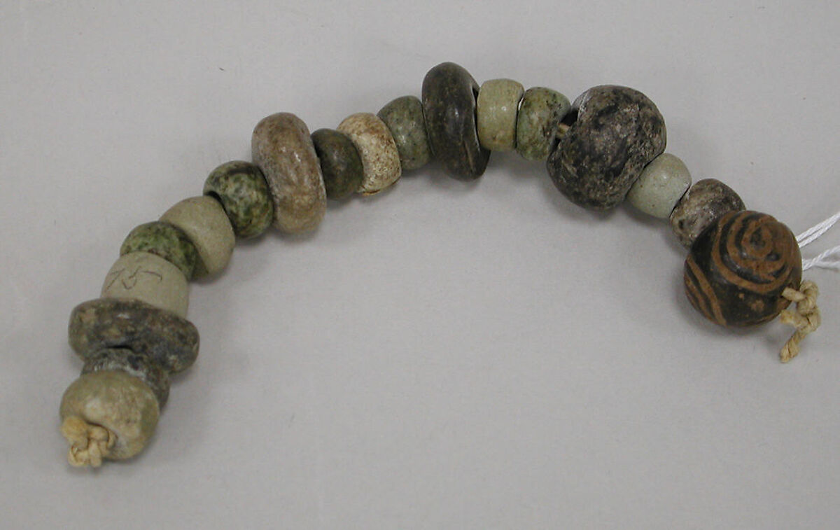 String of flattened beads, Stone, ceramic, Mexican 