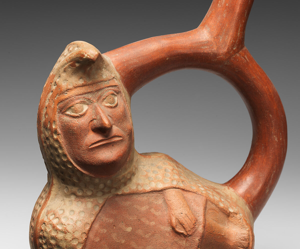 Stirrup-spout bottle with peanut figure, Moche artist(s), Ceramic, slip, Moche