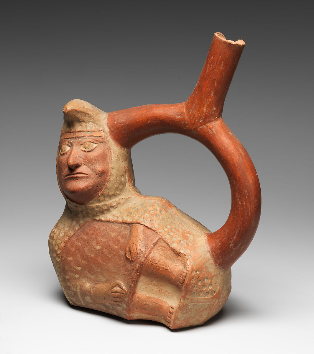 Stirrup-spout bottle with peanut figure, Moche artist(s), Ceramic, slip, Moche