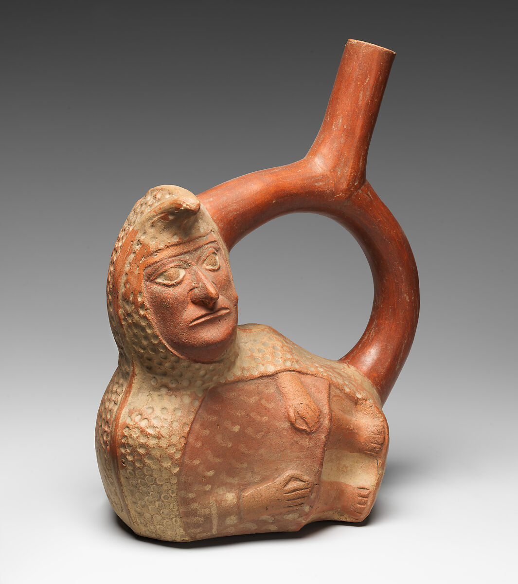 Stirrup-spout bottle with peanut figure, Moche artist(s), Ceramic, slip, Moche