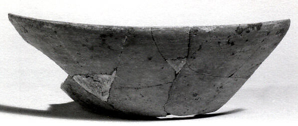 Undecorated painted bowl with flared sides