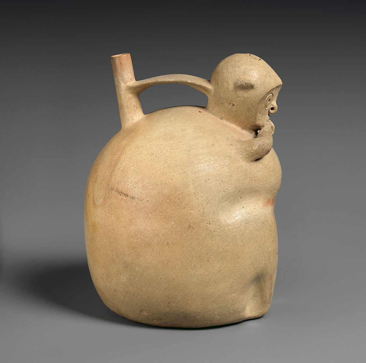 Monkey-shaped spout-and-bridge bottle, Topará artist(s), Ceramic, slip, Topará