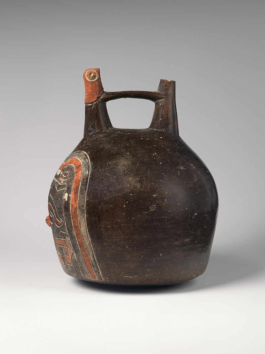 Spout-and-bridge bottle with feline face, Paracas artist(s), Ceramic, post-fire paint, Paracas