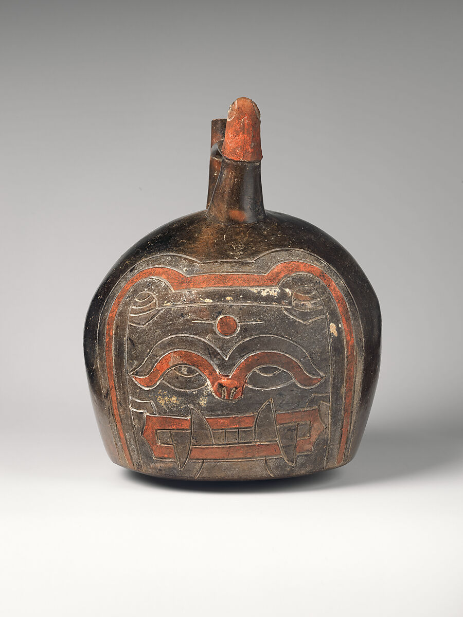 Spout-and-bridge bottle with feline face, Paracas artist(s), Ceramic, post-fire paint, Paracas