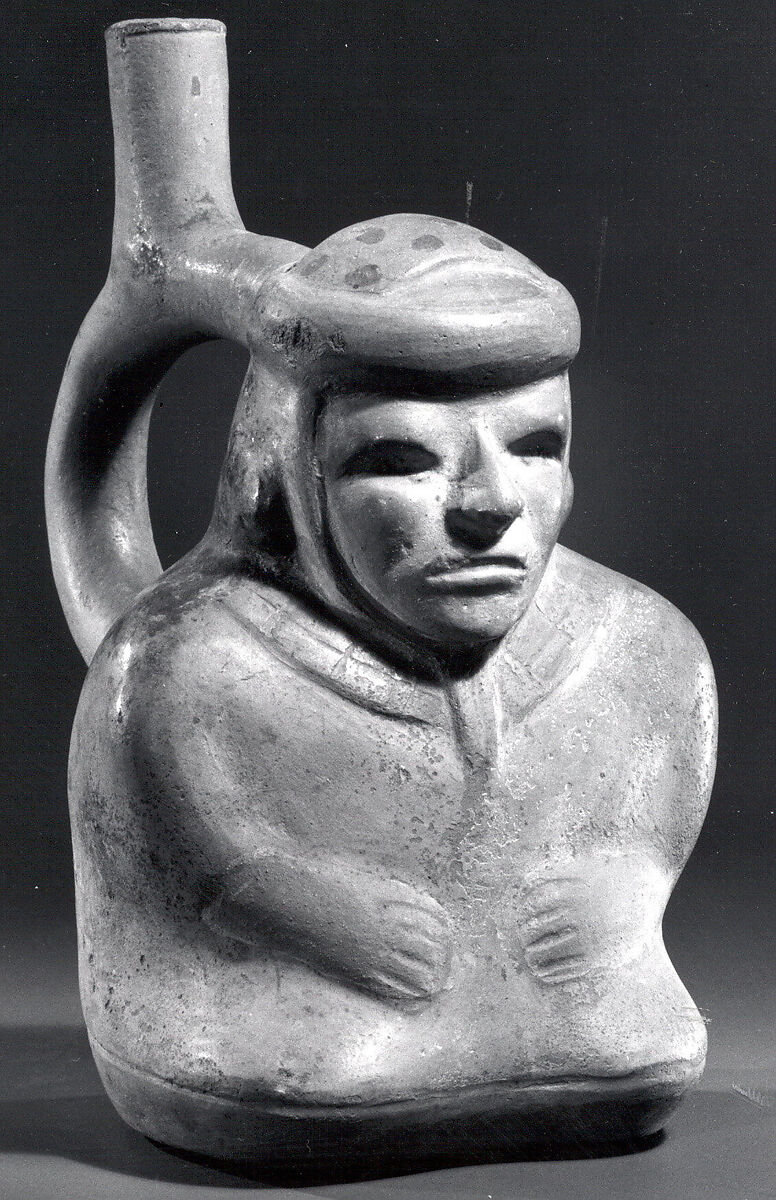 Stirrup spout bottle with sitting blind man, Ceramic, pigment, Moche