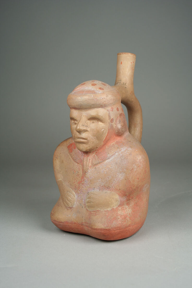 Stirrup spout bottle with sitting blind man, Ceramic, pigment, Moche 