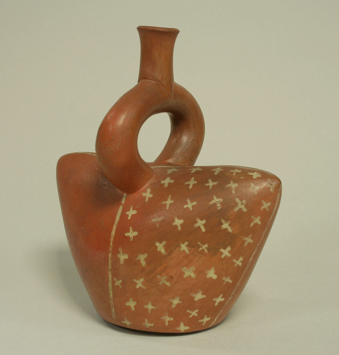 Stirrup spout bottle in cap shape, Ceramic, Moche or Salinar (?)