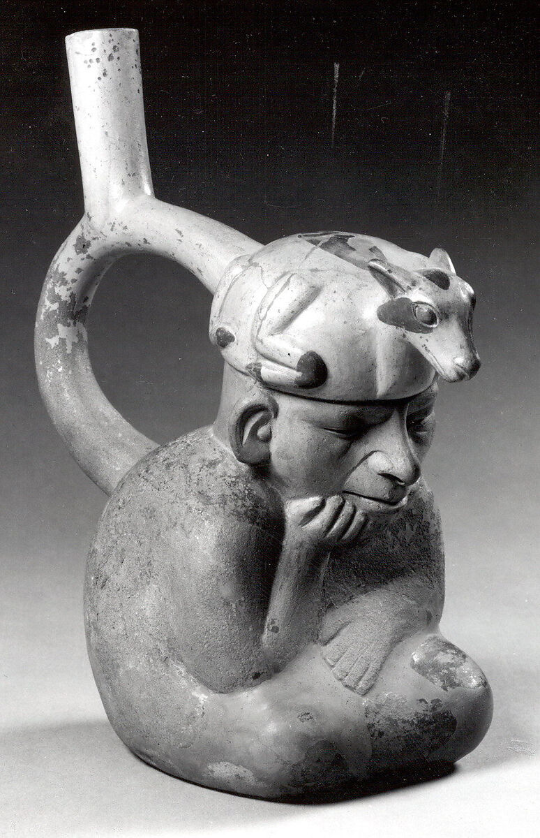 Stirrup spout bottle with figure with llama headdress, Ceramic, slip, Moche