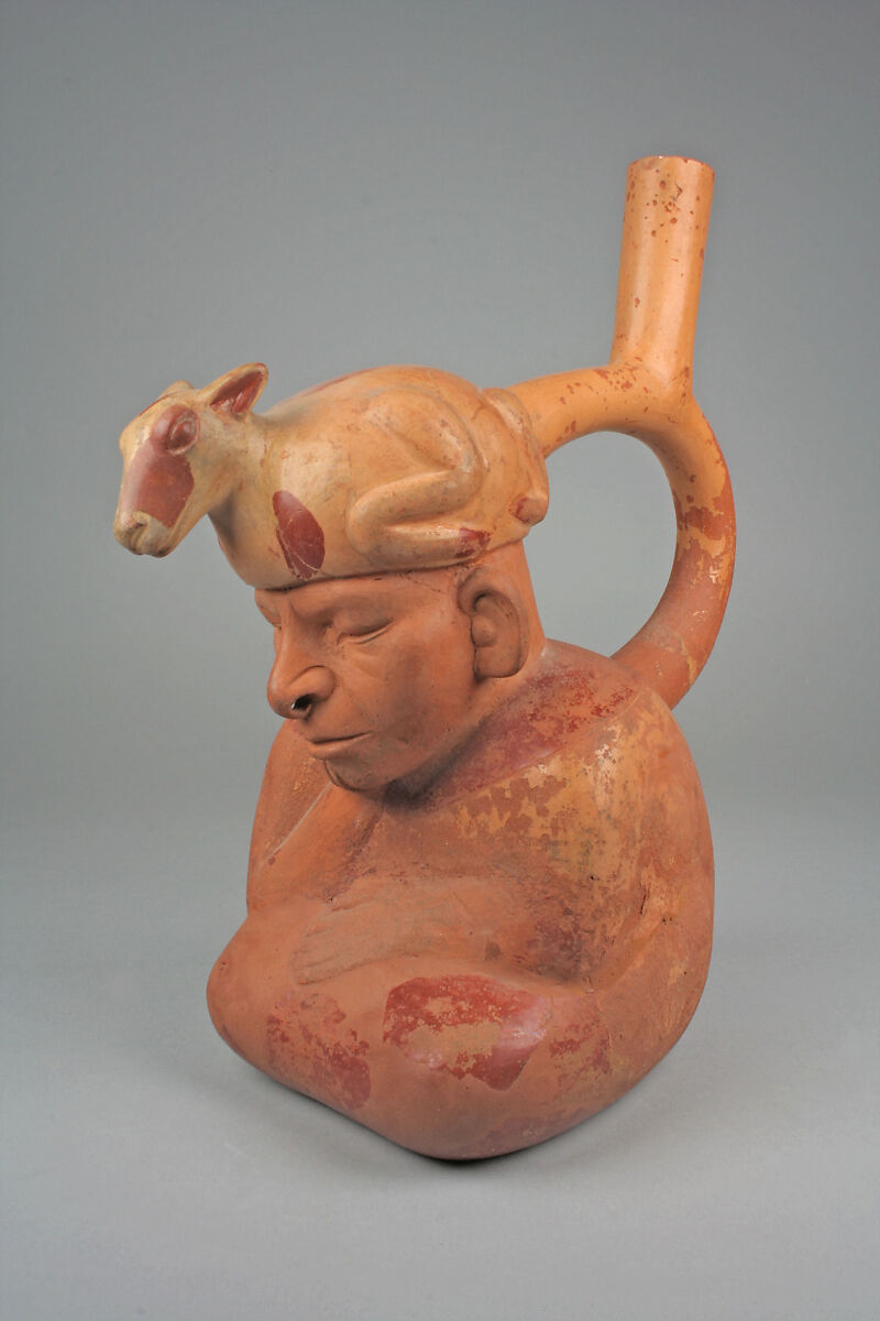 Stirrup spout bottle with figure with llama headdress, Ceramic, slip, Moche 