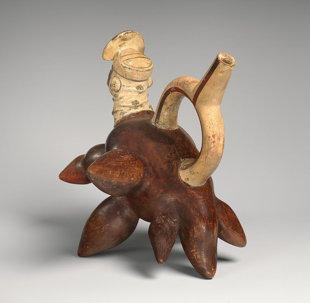 Tuber-inspired stirrup-spout bottle, Moche artist(s), Ceramic, slip, Moche