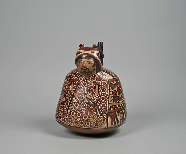 Spout-and-bridge bottle with warrior