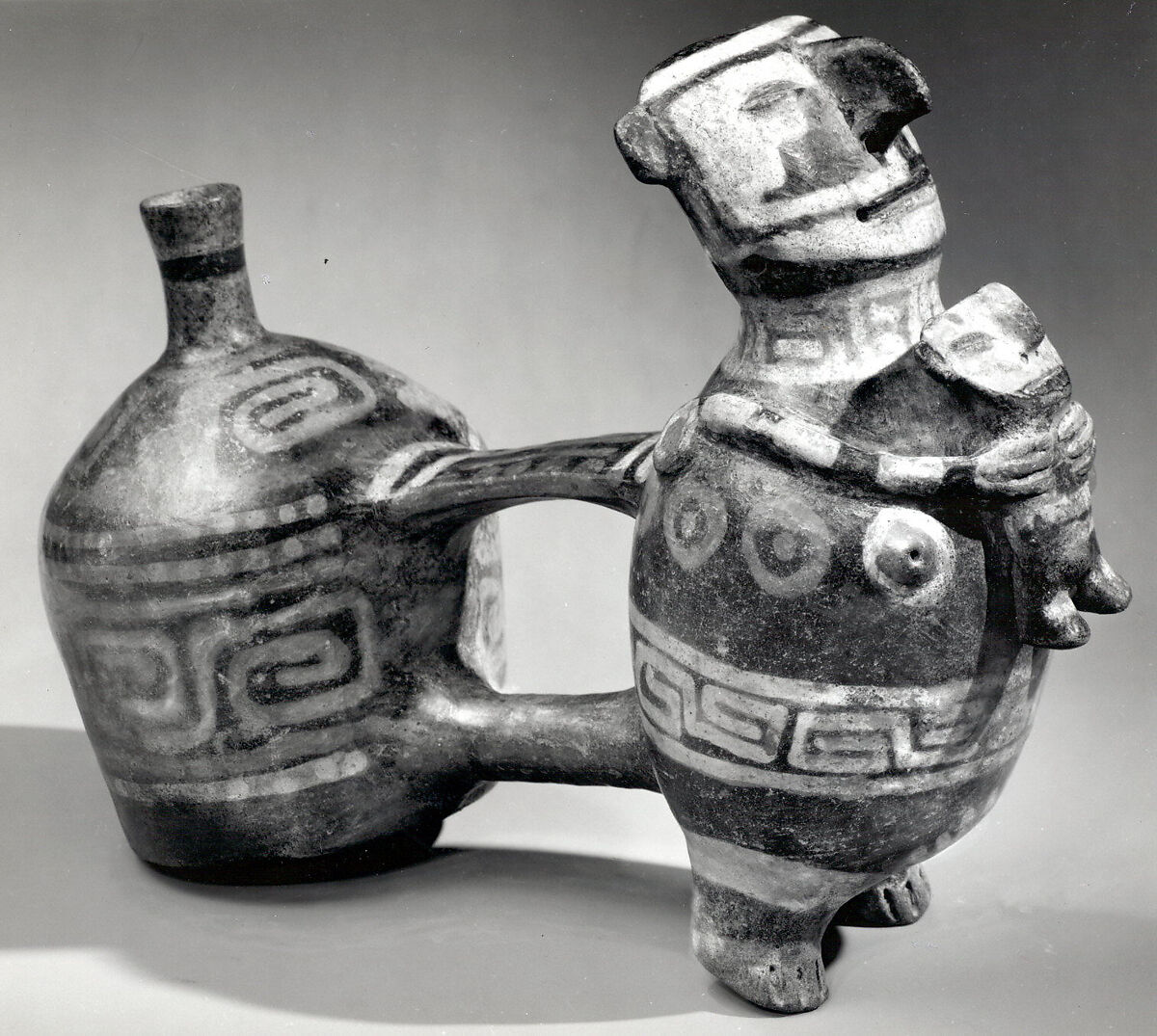 Double-chambered bottle with effigy figures, Vicús artist(s), Ceramic, pigment, Vicús