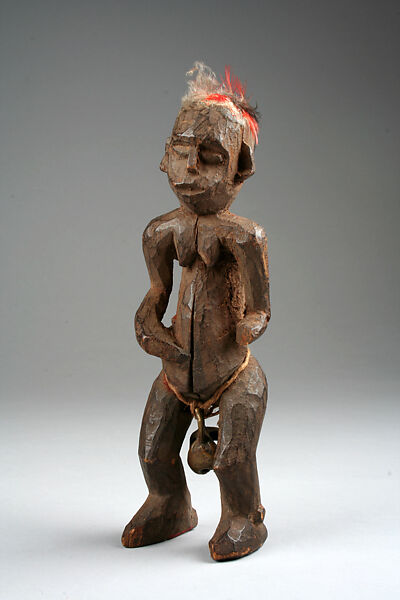Figure: Female with Bell, Wood, feathers, brass bell, fibers, Bamileke (Bagam) 