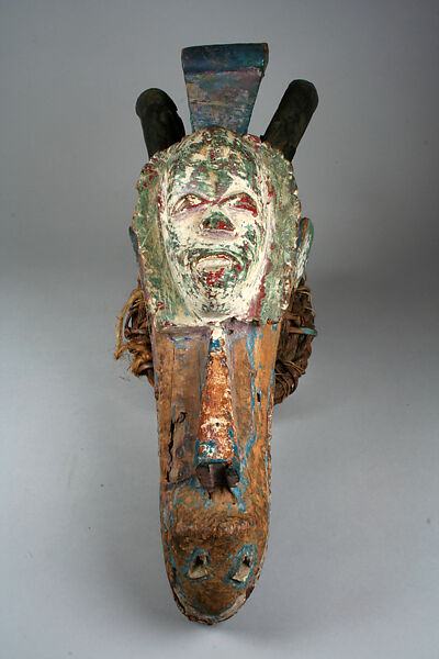 Headdress: Horned Animal Head and Mask, Urhobo artist, Wood, polychrome pigment, cane, beads, cloth, Urhobo peoples