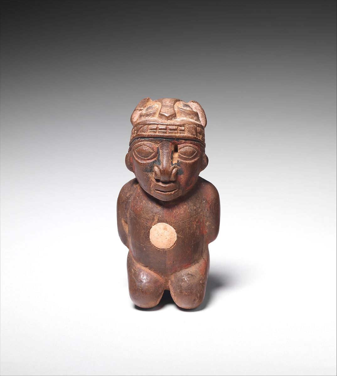 Lime container in the shape of a captive, Wari artist(s), Wood, bone inlay, paint, fiber, Wari 