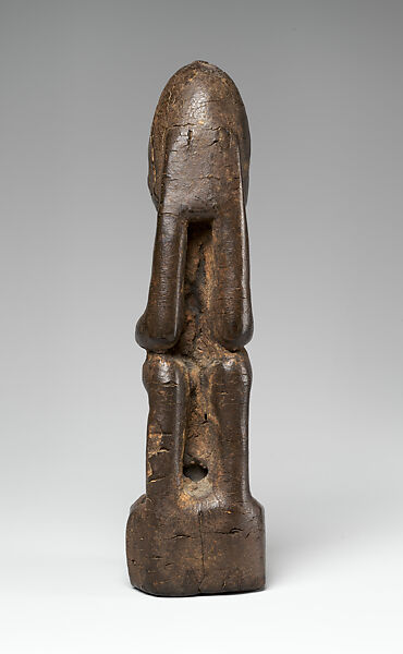 Seated Figure (Dyongou Serou), Dogon blacksmith, Wood, sacrificial materials, Dogon peoples