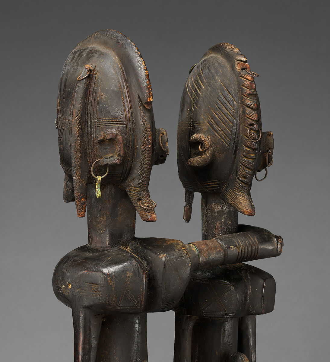 Seated couple, "Barnes Foundation Master" (active late 18th–early 19th century[?], Bandiagara Escarpment, Mali), Wood, copper and iron alloy, applied organic materials, Dogon peoples