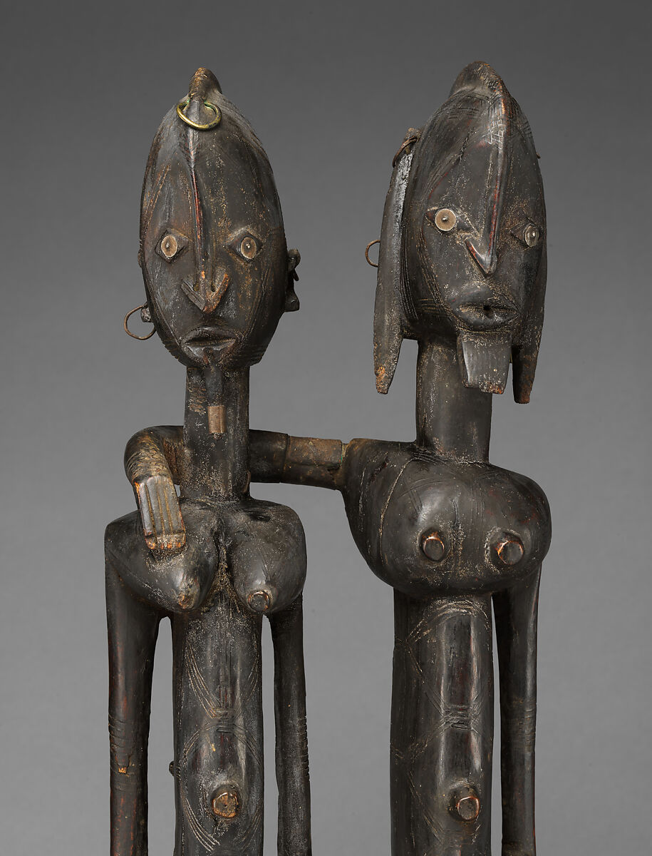Seated couple, "Barnes Foundation Master" (active late 18th–early 19th century[?], Bandiagara Escarpment, Mali), Wood, copper and iron alloy, applied organic materials, Dogon peoples