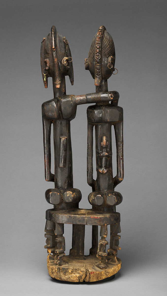 Seated couple, "Barnes Foundation Master" (active late 18th–early 19th century[?], Bandiagara Escarpment, Mali), Wood, copper and iron alloy, applied organic materials, Dogon peoples