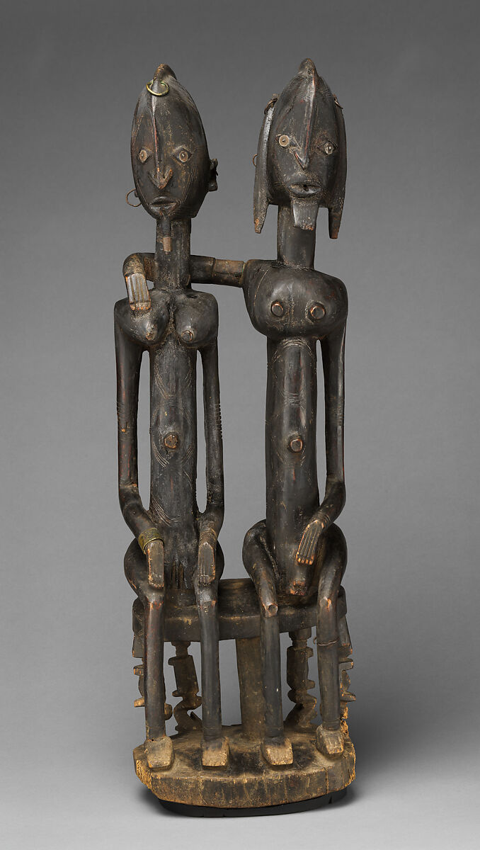Seated couple, "Barnes Foundation Master" (active late 18th–early 19th century[?], Bandiagara Escarpment, Mali), Wood, copper and iron alloy, applied organic materials, Dogon peoples