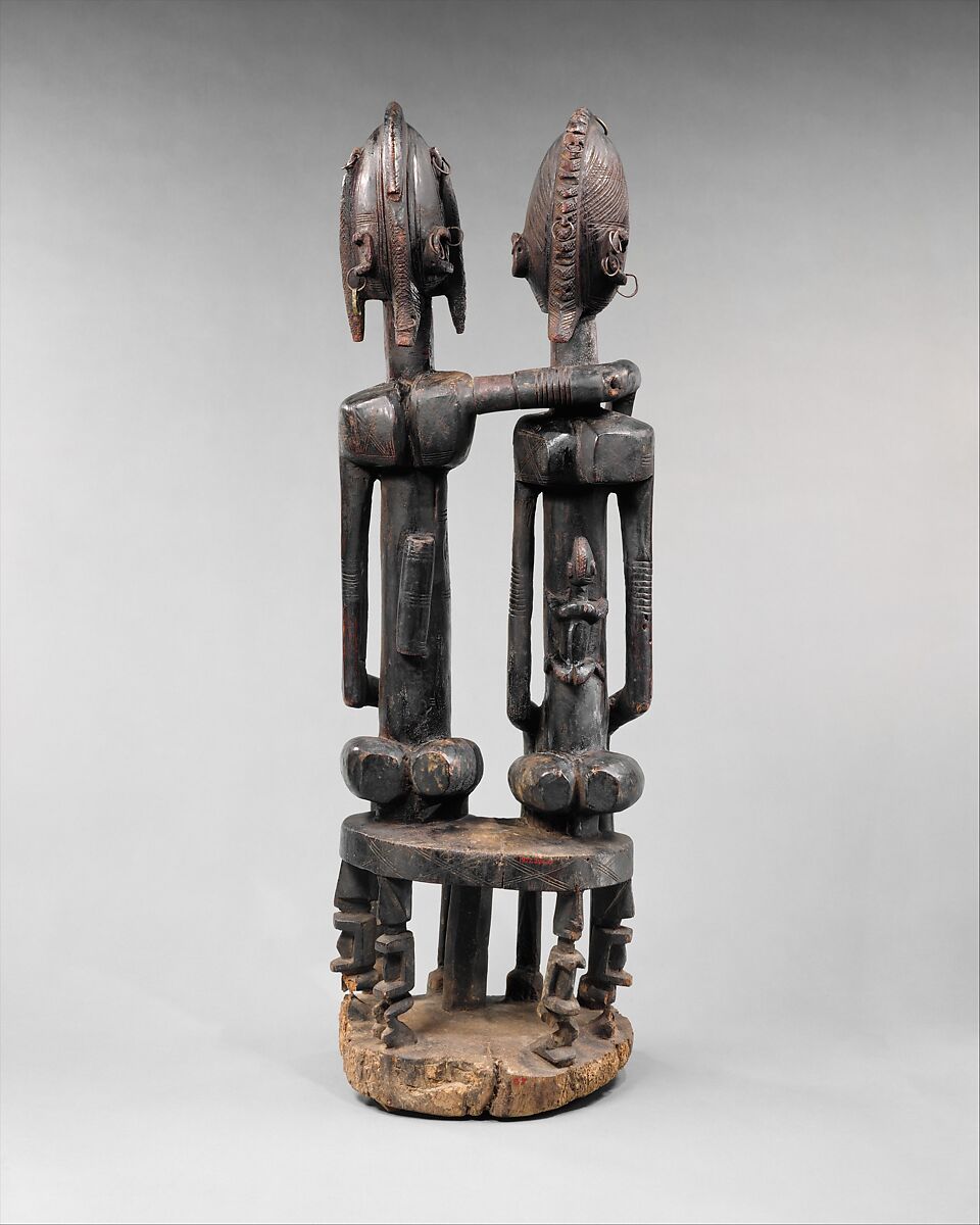 Seated couple, "Barnes Foundation Master" (active late 18th–early 19th century[?], Bandiagara Escarpment, Mali), Wood, copper and iron alloy, applied organic materials, Dogon peoples
