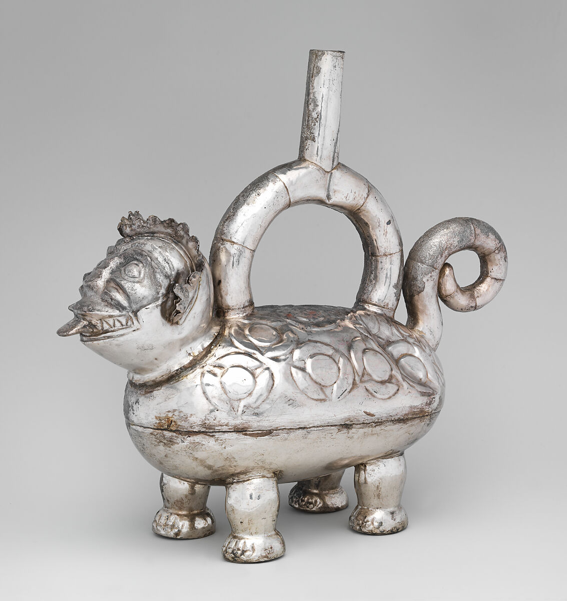 Feline-shaped stirrup-spout bottle, Chimú artist(s), Silver, Chimú 