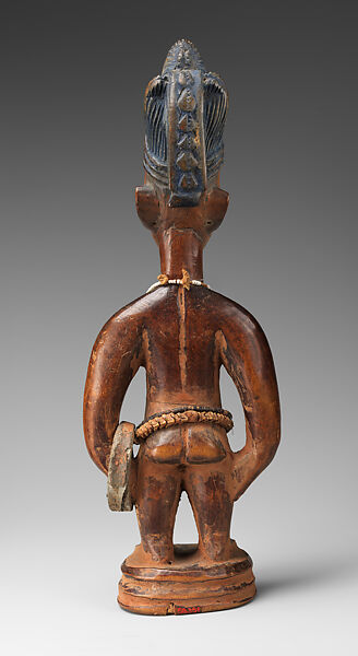 Twin Figure: Male (Ibeji), Workshop of Ibuke Compound, Wood, camwood powder, indigo, beads, iron, vertebrae, Oyo-Yoruba peoples