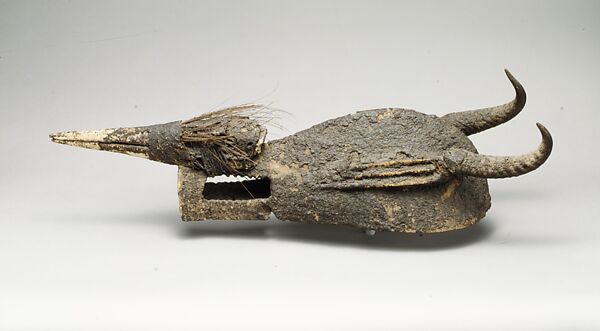 Kòmò Helmet Mask (Kòmòkun), Bamana numu or Senufo blacksmith, Wood, encrustation, quills, feathers, horns, bird skull, Bamana or Senufo peoples, Kòmò or Kòma Power Association
