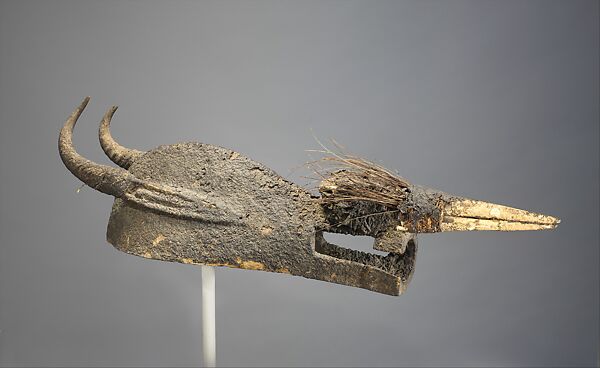 Kòmò Helmet Mask (Kòmòkun), Bamana numu or Senufo blacksmith, Wood, encrustation, quills, feathers, horns, bird skull, Bamana or Senufo peoples, Kòmò or Kòma Power Association
