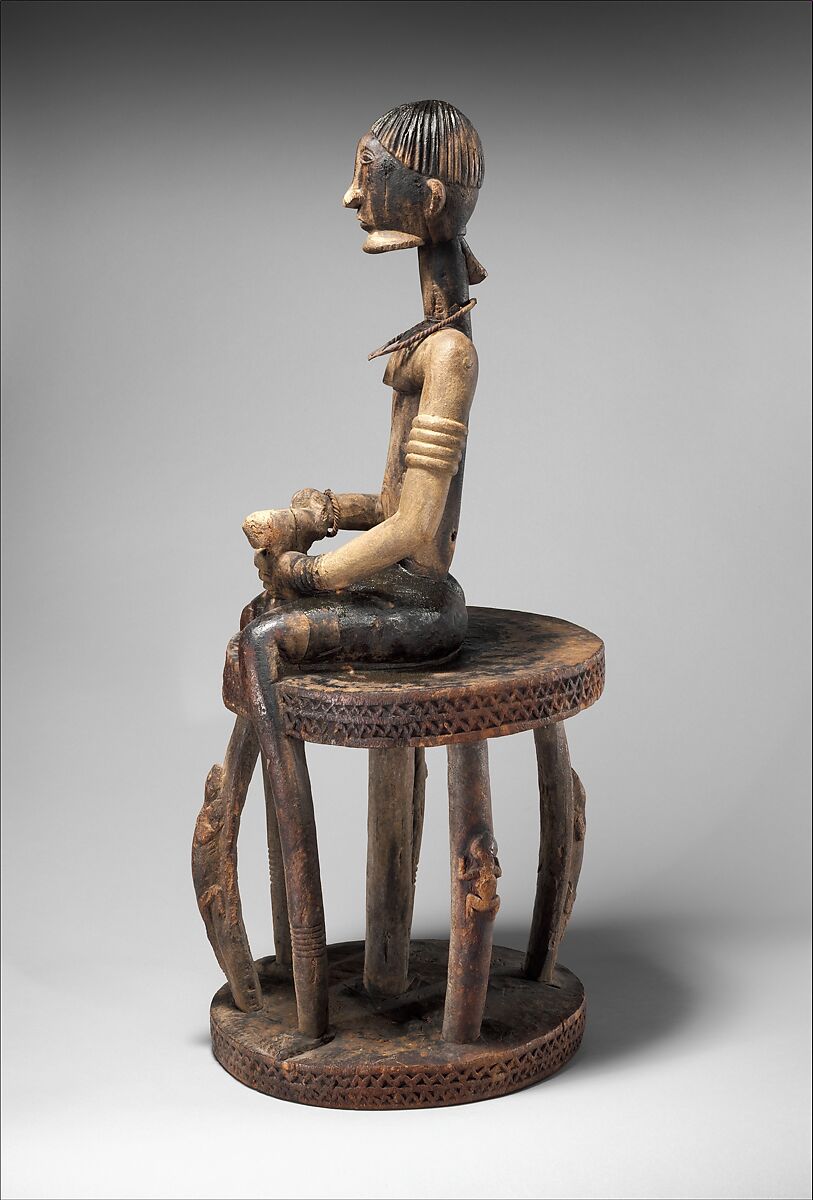 Seated binukedine ( priest), Dogon blacksmith, Wood, iron, Dogon peoples