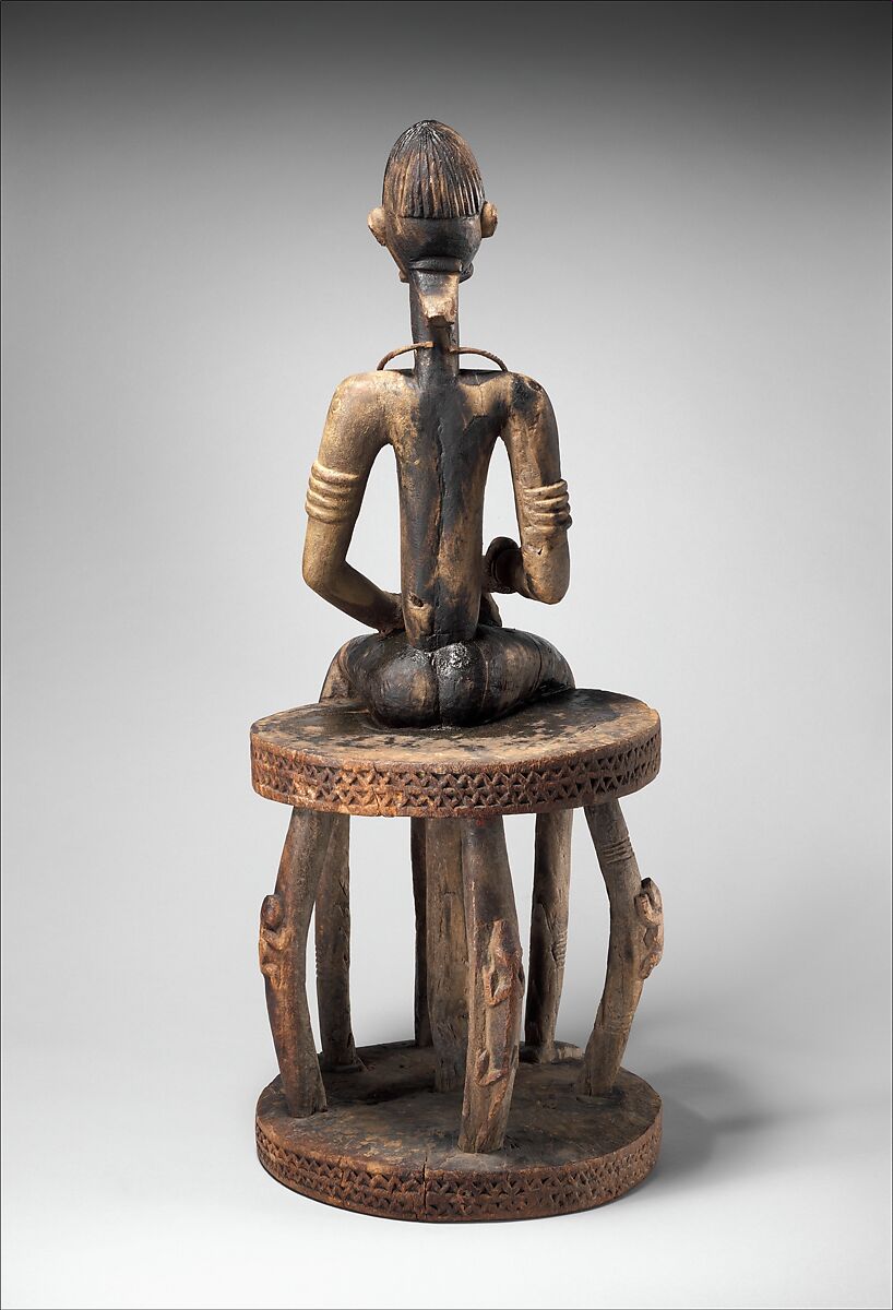 Seated binukedine ( priest), Dogon blacksmith, Wood, iron, Dogon peoples