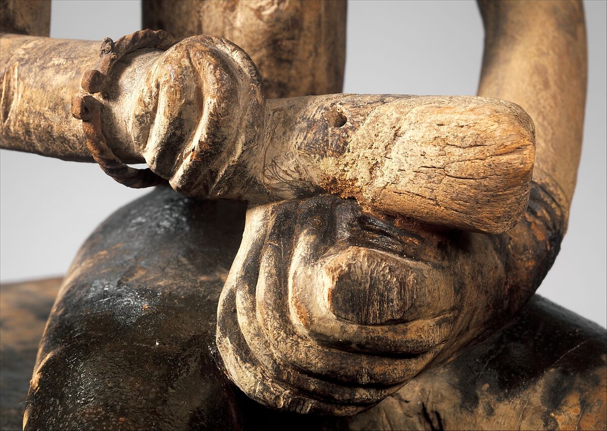 Seated binukedine ( priest), Dogon blacksmith, Wood, iron, Dogon peoples