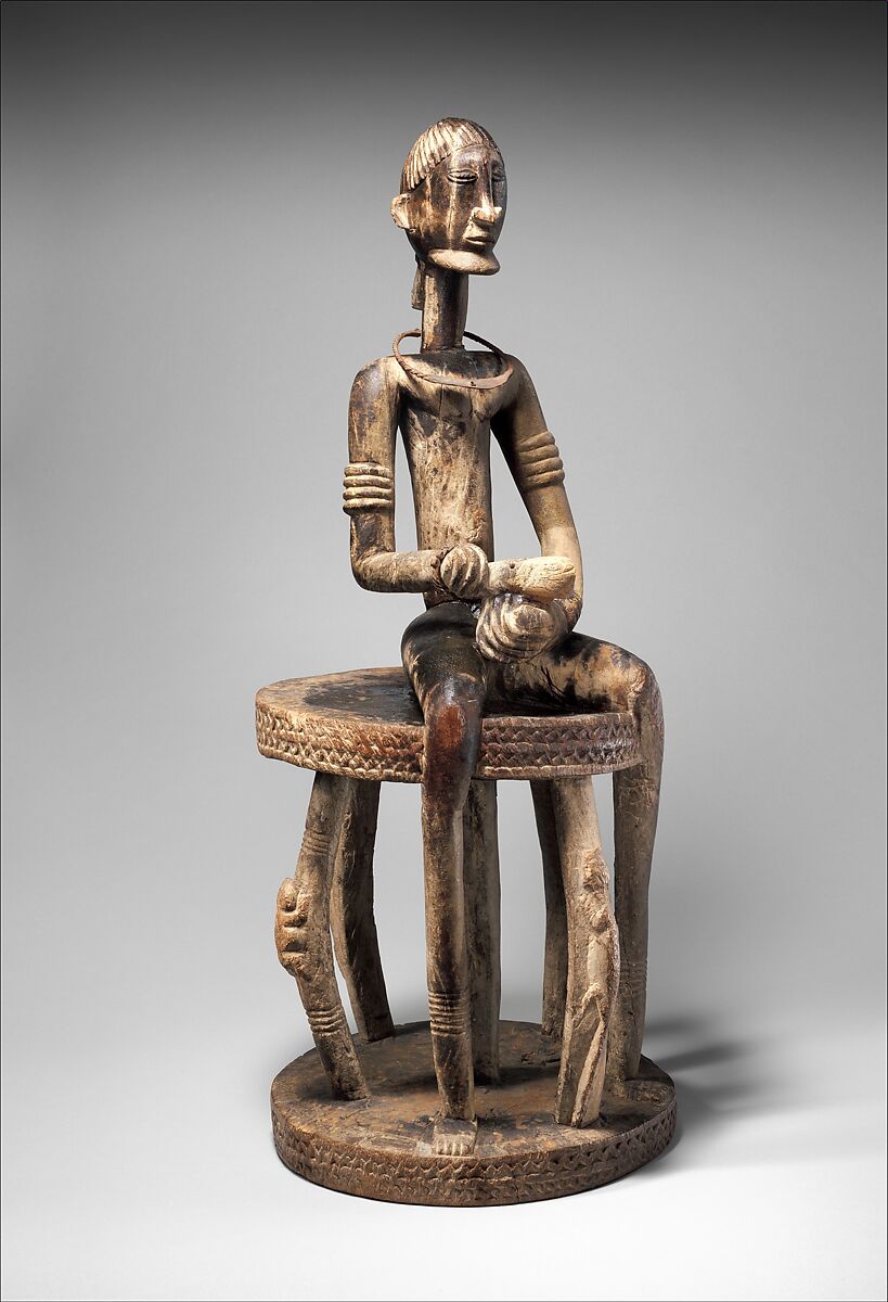 Seated binukedine ( priest), Dogon blacksmith, Wood, iron, Dogon peoples