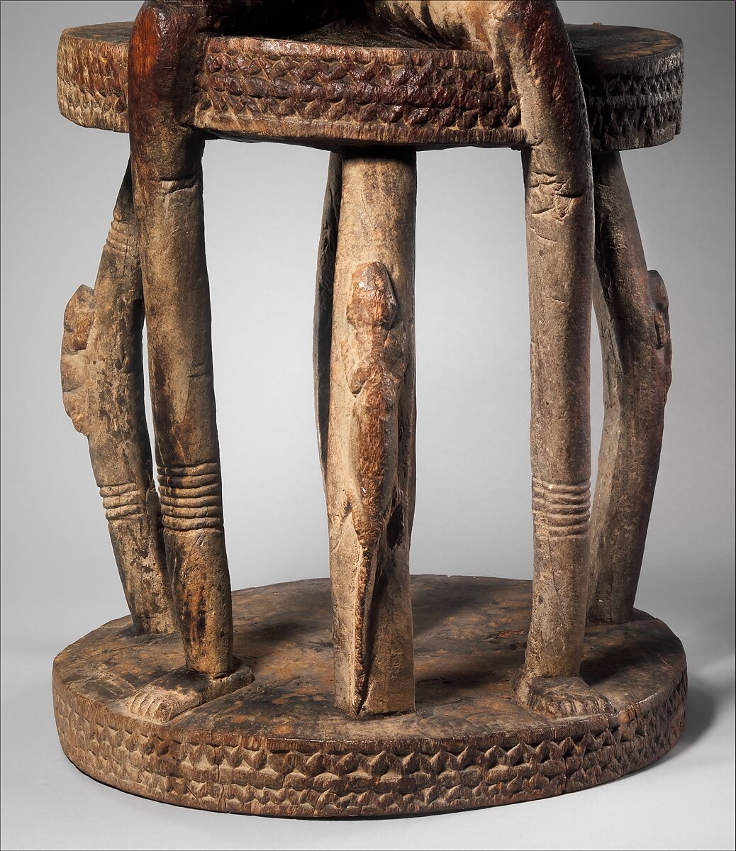 Seated binukedine ( priest), Dogon blacksmith, Wood, iron, Dogon peoples