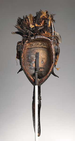 Koma su face mask, Mau artist(s) and ritual specialist(s), Wood, clay, vulture(?) feathers, horn, cotton, vegetable fiber, applied organic materials, Mau peoples