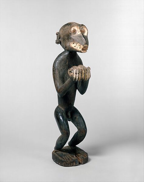 Simian figure with cupped hands (Amuin, possibly for mbra), Wood, pigment, fiber, hair, patina, feathers, ferrous alloy, sacrificial materials, Baule peoples 