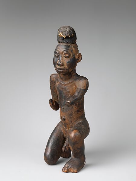 Kneeling nkisi (power figure), Kongo artist, Wood, cloth traces, applied organic matter, bone, resin, Kongo peoples