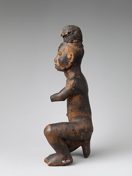 Kneeling nkisi (power figure), Kongo artist, Wood, cloth traces, applied organic matter, bone, resin, Kongo peoples