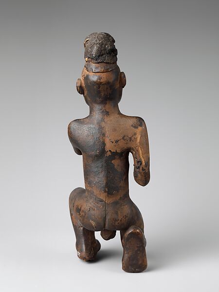 Kneeling nkisi (power figure), Kongo artist, Wood, cloth traces, applied organic matter, bone, resin, Kongo peoples