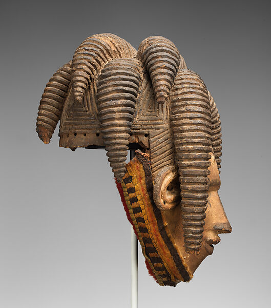 Agbogho mmuo (maiden spirit) face mask, Igbo artist, Wood, pigment, cloth, wire, thread, applied organic material, Igbo peoples